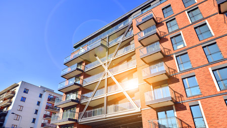 Modern apartment buildings on a sunny day with a blue sky. Facade of a modern apartment buildingの写真素材