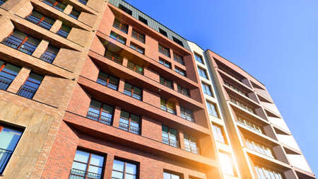 Modern apartment buildings on a sunny day with a blue sky. Facade of a modern apartment buildingの写真素材