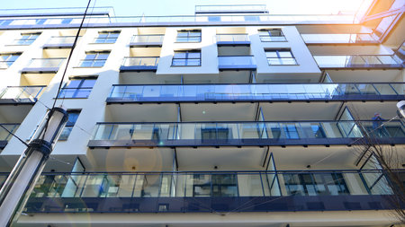 Modern apartment buildings on a sunny day with a blue sky. Facade of a modern apartment buildingの写真素材