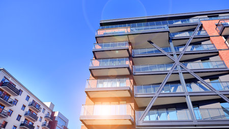 Modern apartment buildings on a sunny day with a blue sky. Facade of a modern apartment buildingの写真素材