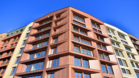 Modern apartment buildings on a sunny day with a blue sky. Facade of a modern apartment buildingの写真素材