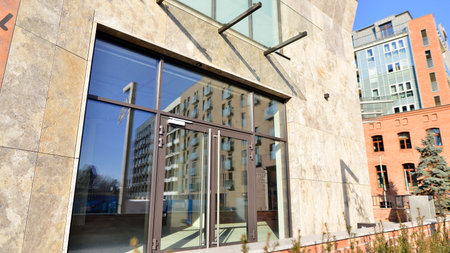 View of a modern commercial premises with a large glass front on a very bright day. New commercial premises waiting to be rented.の写真素材