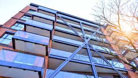 Modern apartment buildings on a sunny day with a blue sky. Facade of a modern apartment buildingの写真素材
