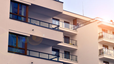 Modern and new apartment building. Multistory modern, new and stylish living block of flats.の写真素材