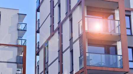 Modern and new apartment building. Multistory modern, new and stylish living block of flats.の写真素材