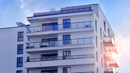 Modern and new apartment building. Multistory modern, new and stylish living block of flats.の写真素材