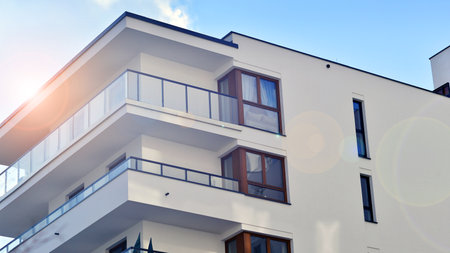 Modern and new apartment building. Multistory modern, new and stylish living block of flats.の写真素材