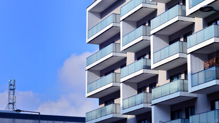 Modern and new apartment building. Multistory modern, new and stylish living block of flats.の写真素材