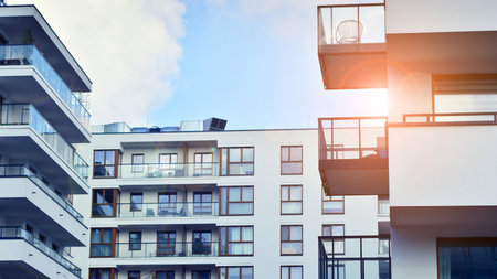 Modern and new apartment building. Multistory modern, new and stylish living block of flats.の写真素材