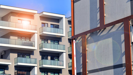 Modern and new apartment building. Multistory modern, new and stylish living block of flats.の写真素材