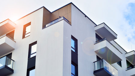 Modern and new apartment building. Multistory modern, new and stylish living block of flats.の写真素材