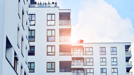 Modern and new apartment building. Multistory modern, new and stylish living block of flats.の写真素材