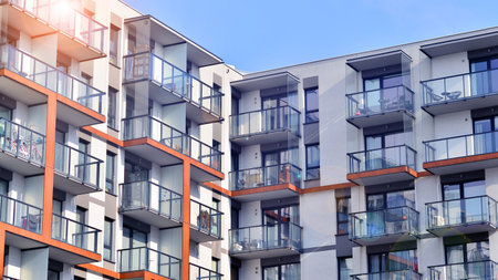 Modern and new apartment building. Multistory modern, new and stylish living block of flats.の写真素材