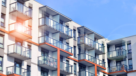 Modern and new apartment building. Multistory modern, new and stylish living block of flats.の写真素材