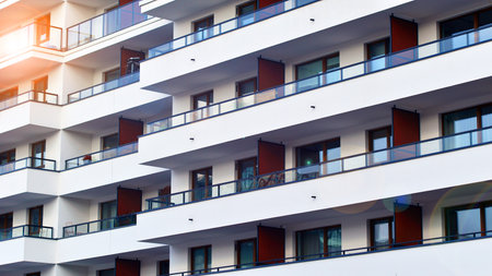 Modern and new apartment building. Multistory modern, new and stylish living block of flats.の写真素材