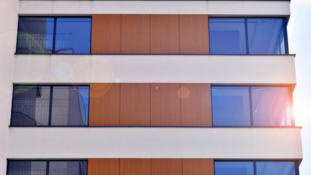 Modern office building with concrete facade and windows. Modern architectural details.の写真素材
