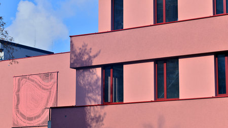 Modern office building with concrete facade and windows. Modern architectural details.の写真素材