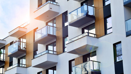 Modern and new apartment building. Multistory modern, new and stylish living block of flats.の写真素材