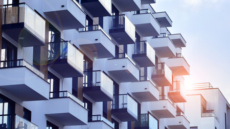 Modern and new apartment building. Multistory modern, new and stylish living block of flats.の写真素材