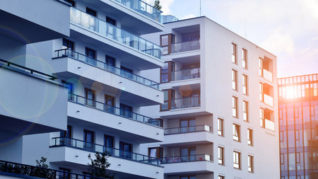 Modern and new apartment building. Multistory modern, new and stylish living block of flats.の写真素材