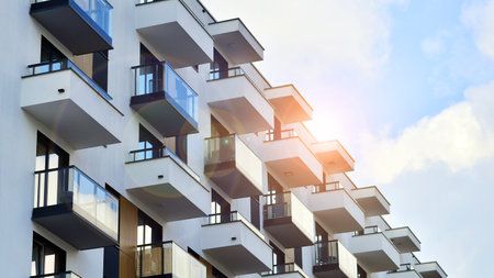 Modern and new apartment building. Multistory modern, new and stylish living block of flats.の写真素材