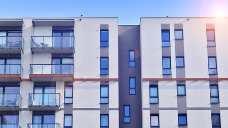 Modern and new apartment building. Multistory modern, new and stylish living block of flats.の写真素材
