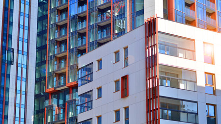 Modern and new apartment building. Multistory modern, new and stylish living block of flats.の写真素材