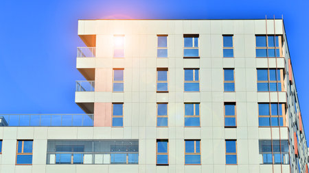 Modern and new apartment building. Multistory modern, new and stylish living block of flats.の写真素材