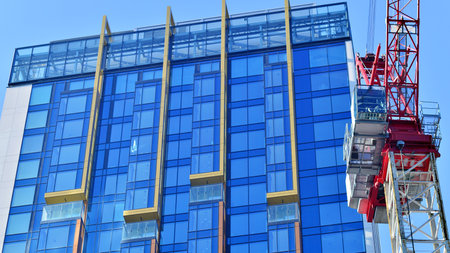 Modern and new apartment building. Multistory modern, new and stylish living block of flats.の写真素材