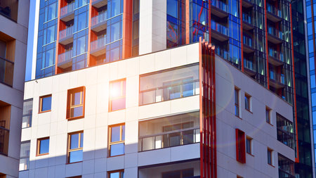 Modern and new apartment building. Multistory modern, new and stylish living block of flats.の写真素材