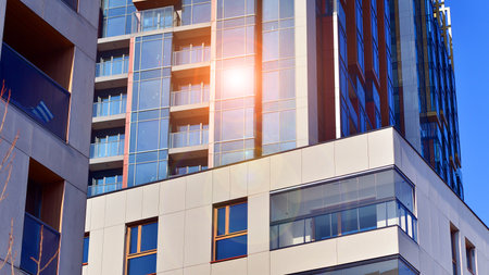 Modern and new apartment building. Multistory modern, new and stylish living block of flats.の写真素材