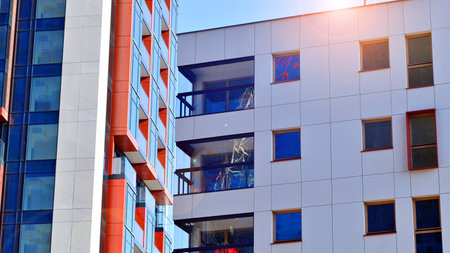 Modern and new apartment building. Multistory modern, new and stylish living block of flats.の写真素材