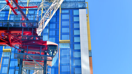 Crane on the construction site in a site surrounded by the high buildings.の写真素材