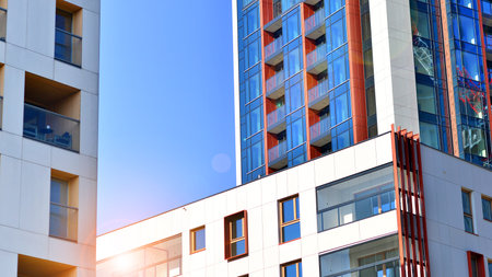 Modern and new apartment building. Multistory modern, new and stylish living block of flats.の写真素材