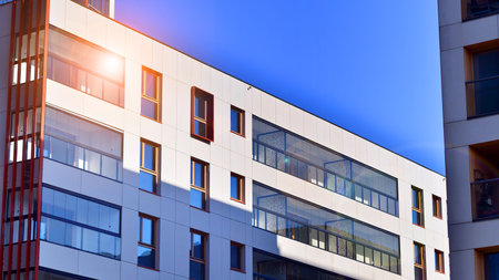 Modern and new apartment building. Multistory modern, new and stylish living block of flats.の写真素材