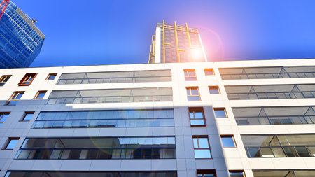 Modern and new apartment building. Multistory modern, new and stylish living block of flats.の写真素材