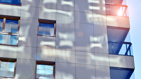 Modern and new apartment building. Multistory modern, new and stylish living block of flats.の写真素材