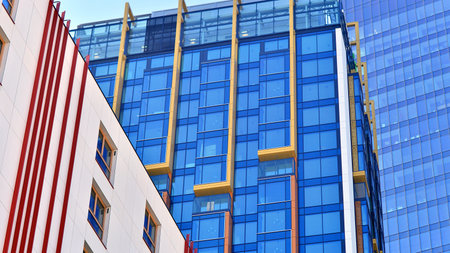 Modern and new apartment building. Multistory modern, new and stylish living block of flats.の写真素材