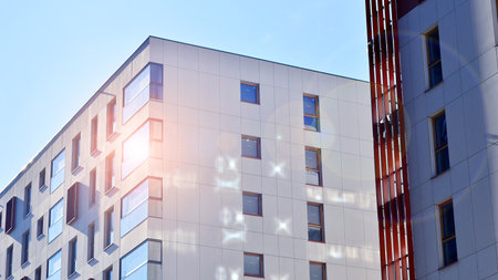 Modern and new apartment building. Multistory modern, new and stylish living block of flats.の写真素材