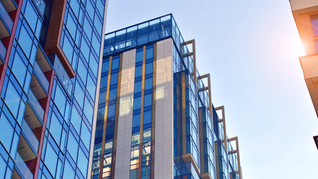 Modern and new apartment building. Multistory modern, new and stylish living block of flats.の写真素材