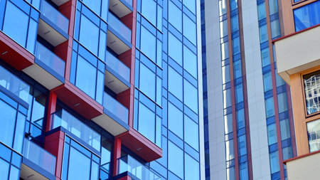 Modern and new apartment building. Multistory modern, new and stylish living block of flats.の写真素材