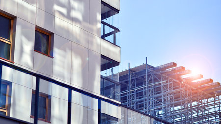 Modern and new apartment building. Multistory modern, new and stylish living block of flats.の写真素材
