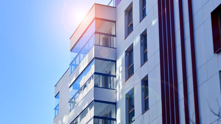 Modern and new apartment building. Multistory modern, new and stylish living block of flats.の写真素材