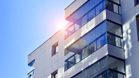 Modern and new apartment building. Multistory modern, new and stylish living block of flats.の写真素材