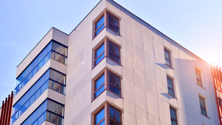 Modern and new apartment building. Multistory modern, new and stylish living block of flats.の写真素材