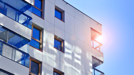 Modern and new apartment building. Multistory modern, new and stylish living block of flats.の写真素材