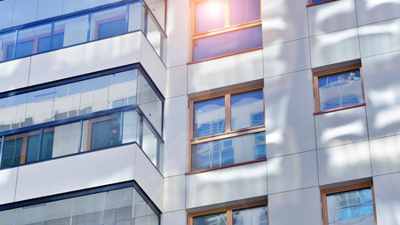Modern and new apartment building. Multistory modern, new and stylish living block of flats.の写真素材