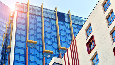 Modern and new apartment building. Multistory modern, new and stylish living block of flats.の写真素材
