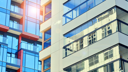 Modern and new apartment building. Multistory modern, new and stylish living block of flats.の写真素材