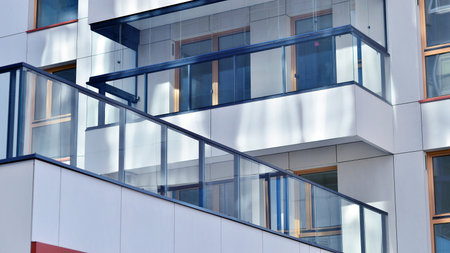 Modern and new apartment building. Multistory modern, new and stylish living block of flats.の写真素材